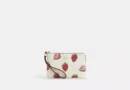 COACH CORNER ZIP WRISTLET - CHALK/FRESAS