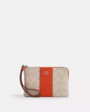 COACH CORNER ZIP WRISTLET IN SIGNATURE CANVAS WITH STRIPE
